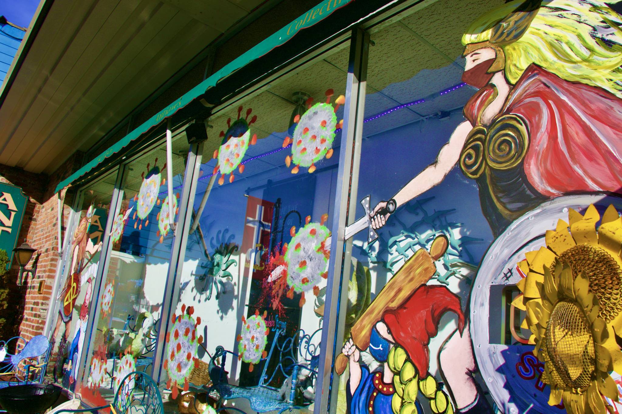 Viking gods bravely fight off coronavirus in the Bad Blanche Collection store mural on Front Street.