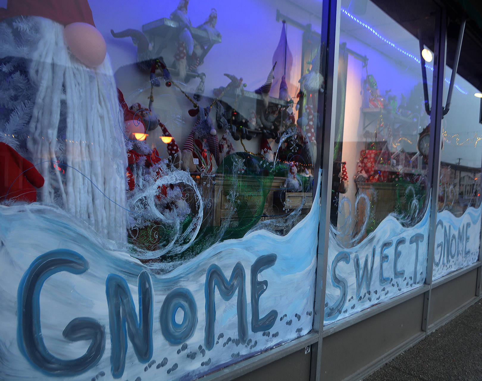 Christmas storefronts are filled with holiday displays.
