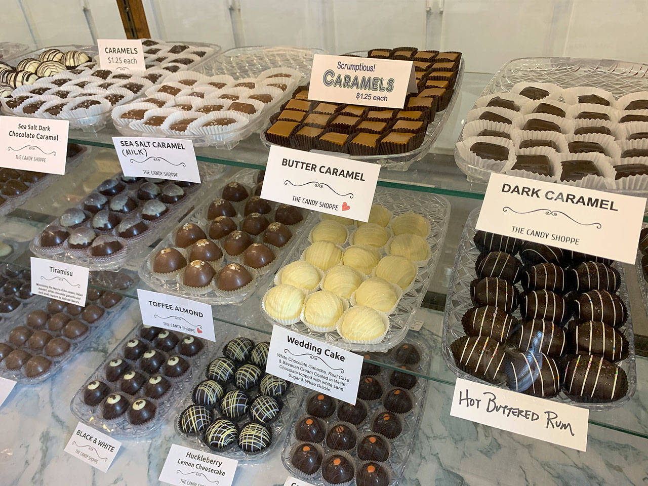 While plain old chocolate is the store’s big seller, customers also crave sea-salt caramel, chocolate walnut and a confectionary called Snickers, which features a caramel center with peanuts and chocolate. (Bob Smith | Kitsap Daily News)
