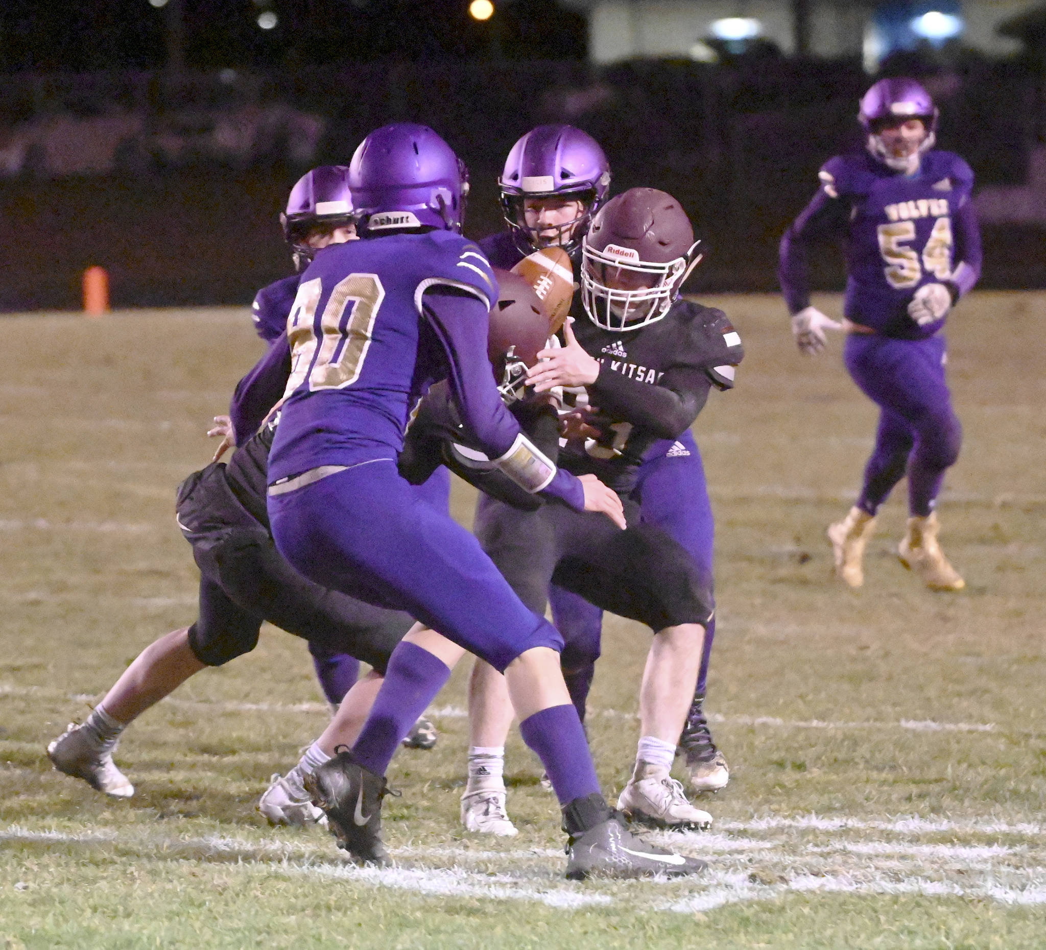 South Kitsap receiver Brayden Segerman tries to get his hands on a pass while surrounded by Sequim defenders. (Michael Dashiell/Sequim Gazette)