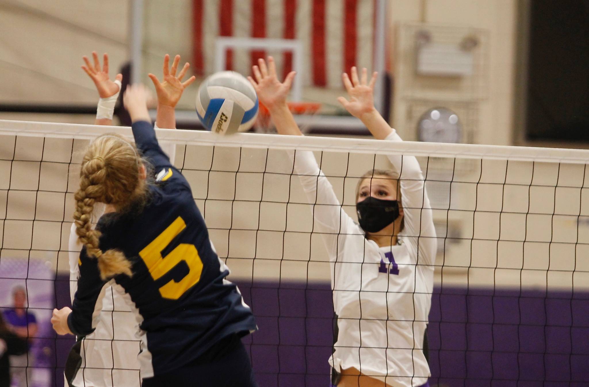 North Kitsap’s Maddie Pryde gets in front of a shot from Bainbridge’s Isabelle Prentice. (Mark Krulish/Kitsap News Group)