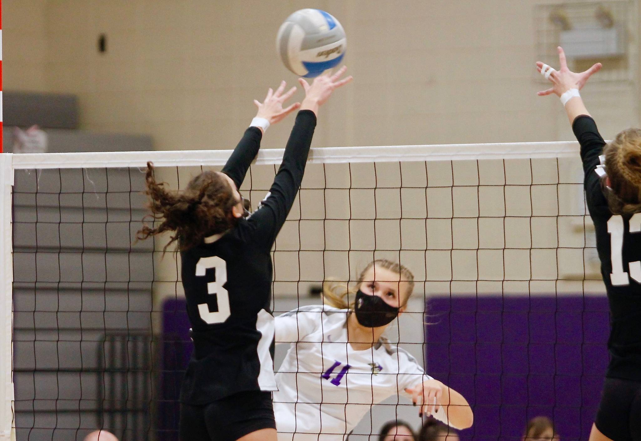 North Kitsap’s Maddie Pryde tries to put a shot past Central Kitsap’s Allie Baldridge in Tuesday night’s match. (Mark Krulish/Kitsap News Group)