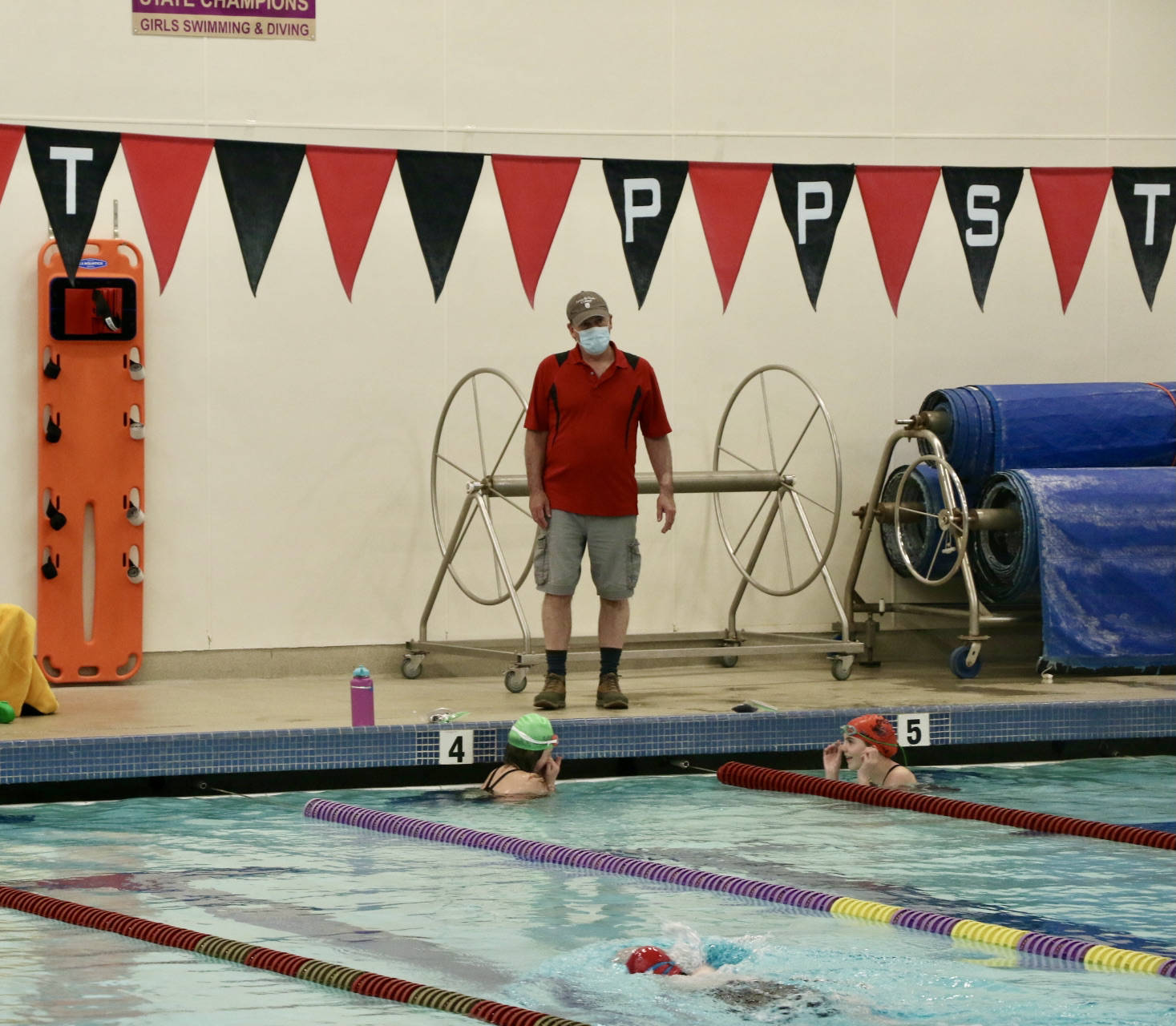 <em>Coach Ron Allen and the Piranha’s kick things off with some practice laps.</em>		Ken Park/North Kitsap Herald