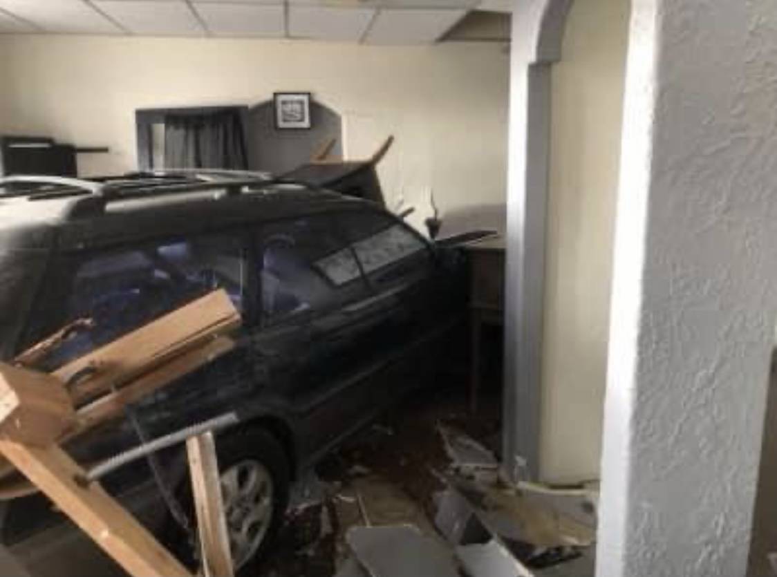 A driver accidentally slammed into two downtown Poulsbo businesses Monday. (Photos courtesy of Poulsbo Fire Department)
Structural engineers were able to remove the vehicle safely from the businesses.