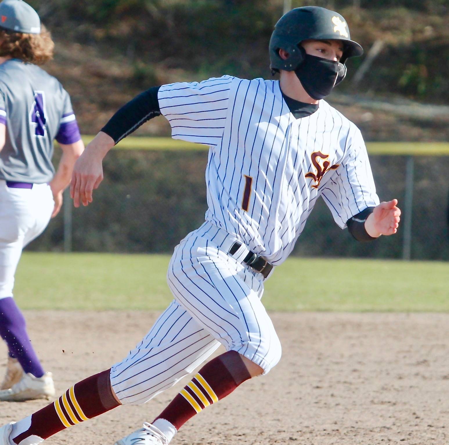 Ty Orser rounds third to score the tying run for South Kitsap against Sumner. (Mark Krulish/Kitsap News Group)