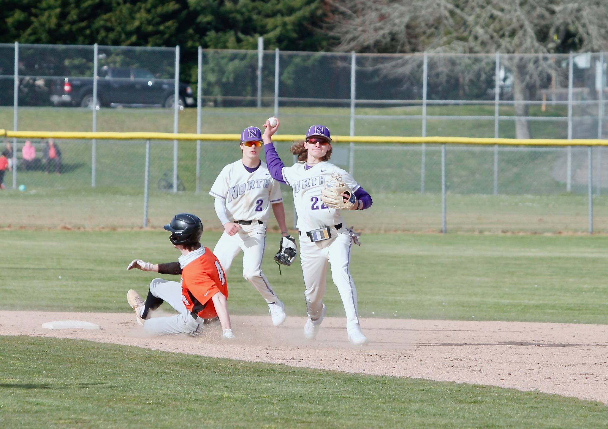 Jaxson Gore (22) makes the throw to complete the double play against Central Kitsap. (Mark Krulish/Kitsap News Group)