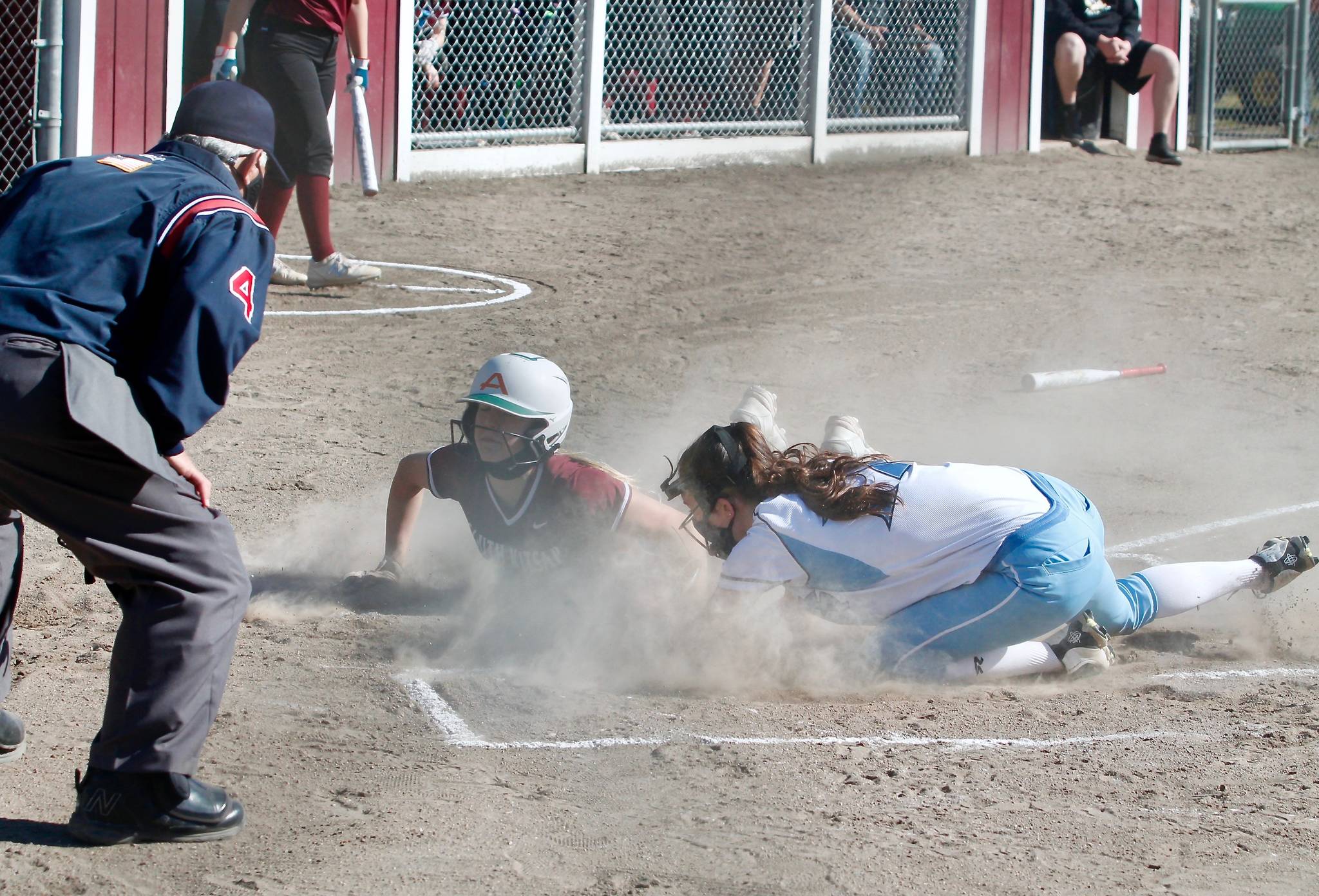 Marisol Bergstrom slides in ahead of the throw to score one of her four runs against Gig Harbor. (Mark Krulish | Kitsap News Group)