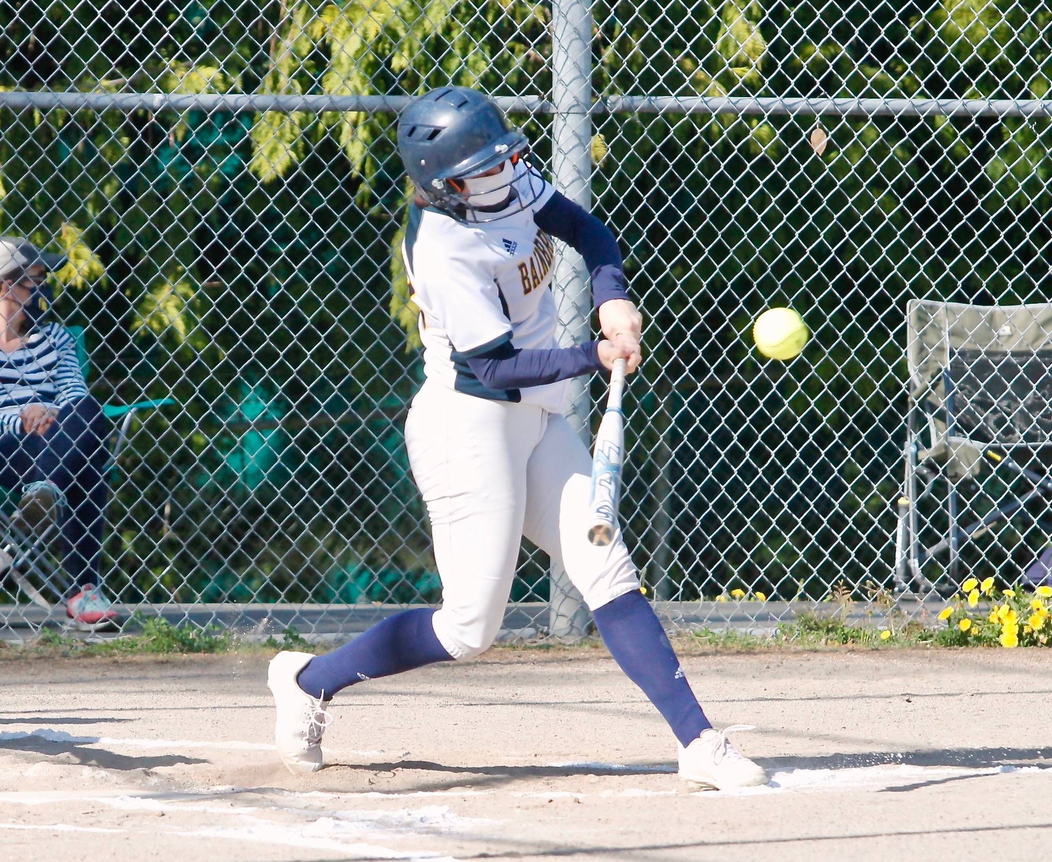 Ruby Raymundo hits one of her two doubles against Olympic. Raymundo finished the game with three hits and one RBI. (Mark Krulish/Kitsap News Group)