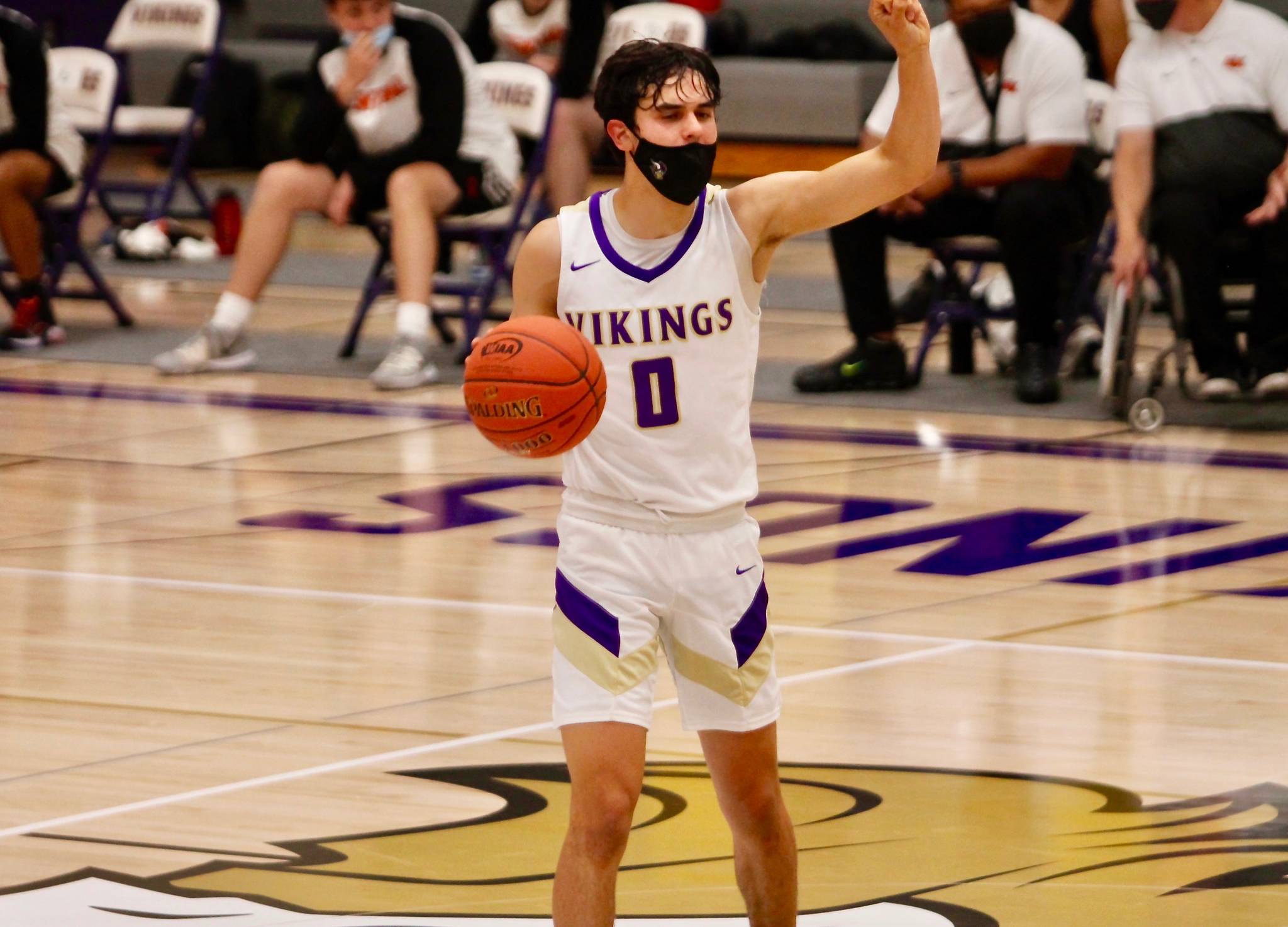 Johny Olmsted calls the play as he directs the offense against Central Kitsap. Olmsted led North Kitsap with 26 points in the 79-51 victory. (Mark Krulish/Kitsap News Group)