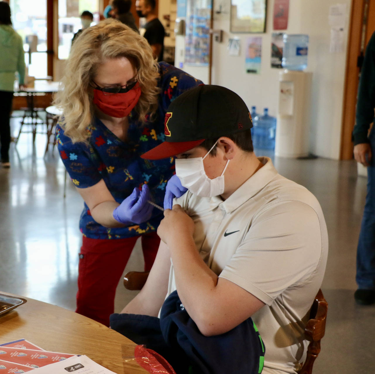Fisher McLeod,son of Jolene Sulluivan, gets his first dose of the Pfizer vaccine. (KPark/NKH)