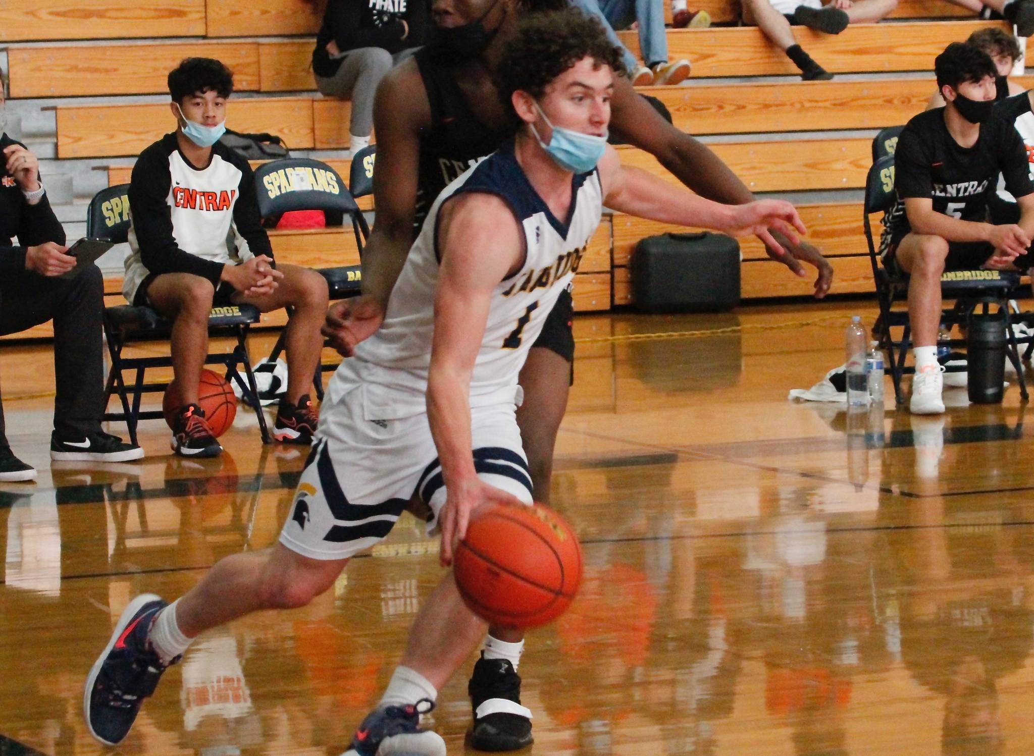 Bainbridge senior Jacob Kirsch evades the Central Kitsap defense on his way to the basket. (Mark Krulish/Kitsap News Group)