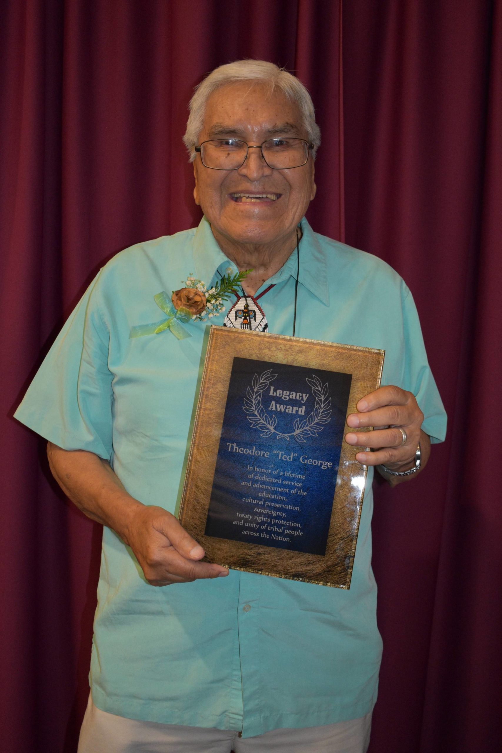Ted George with his namesake award. Courtesy Photo