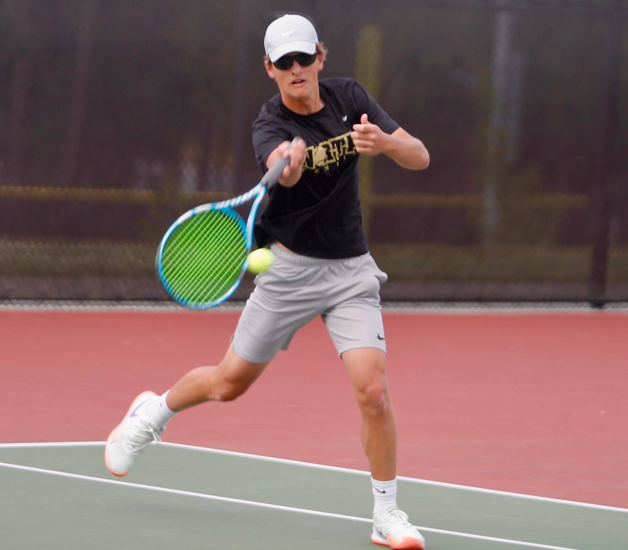 North Kitsap’s Josh Smith attacks the net for a point as he did many times throughout the championship match victory. (Mark Krulish/Kitsap News Group)