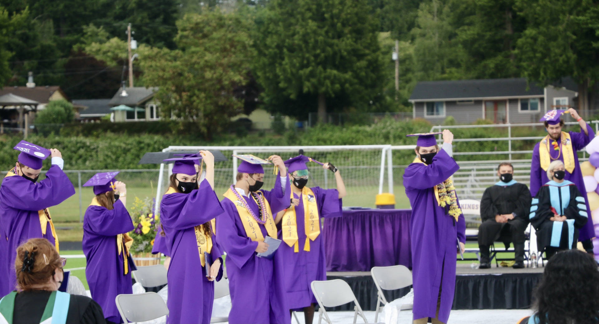 Turning of the tassels to symbolize the transfer from student to graduate.