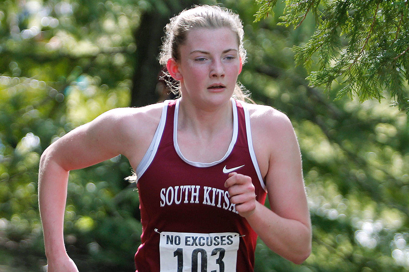 Evelyn Collins-Winn, shown here during the Olympic League cross country championships on Bainbridge Island, will run at the University of Portland in the fall. (Mark Krulish/Kitsap News Group)