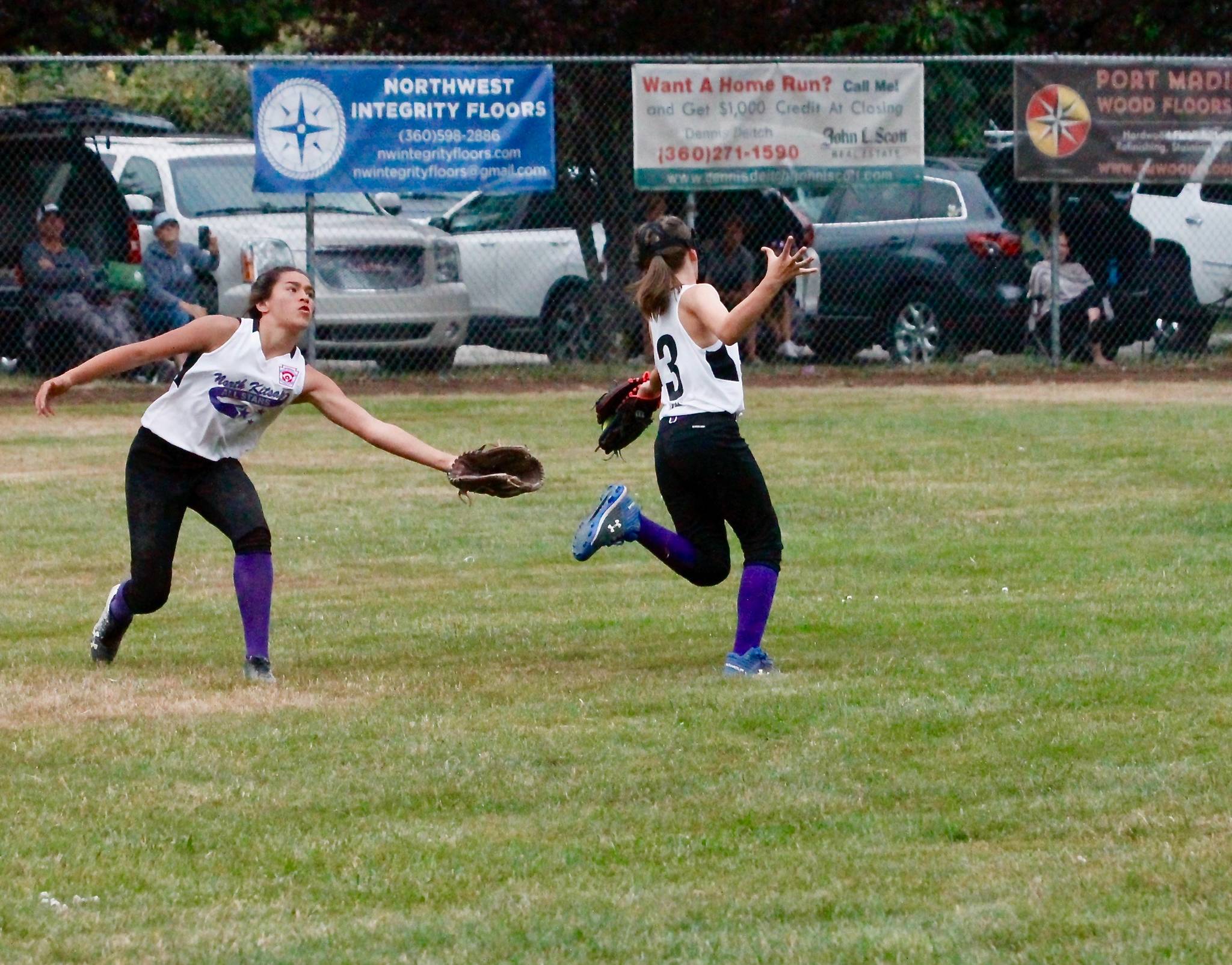 Jaynie Davis (3) makes the grab coming over from leftfield as Layla Baker backs her up. (Mark Krulish/Kitsap News Group)