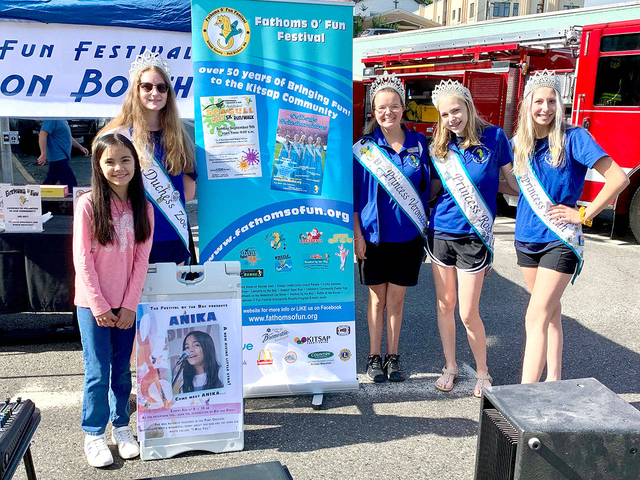 Manchester singer Anika (left) is joined by the Fathoms O’ Fun Festival princesses following her performance at the summer festival on Sunday. (Bob Smith | Kitsap Daily News)