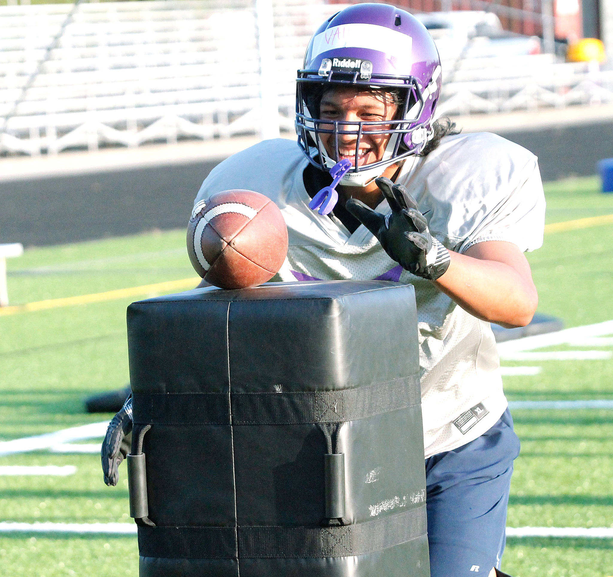 Happy to be back — North Kitsap sophomore EJ Vailolo goes for the ball in a drill during this week’s football practice. The Vikings’ first game is Sept. 3. (Mark Krulish/Kitsap News Group)