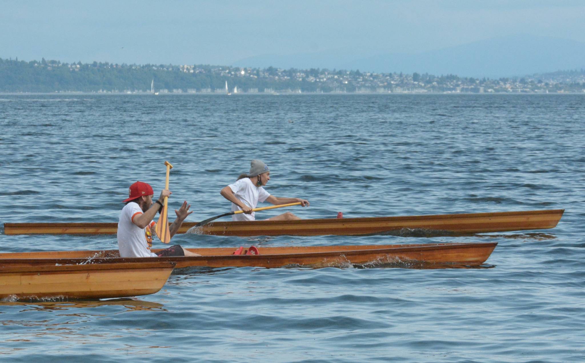 Suquamish competitors participate in “war canoe” races just off the shore from the Suquamish Tribe’s House of Awakened Culture in downtown Suquamish on Saturday. (Photo by Jon Anderson/Courtesy of Suquamish Tribe)