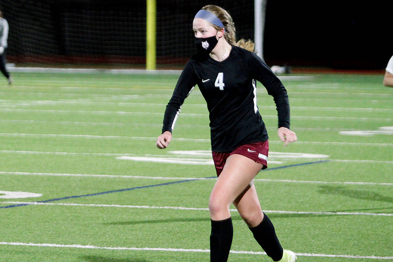 Hailey Deese leads the rush upfield during last year’s match against Bremerton. South Kitsap has a number of returners from last spring’s varsity team. (Mark Krulish/Kitsap News Group)