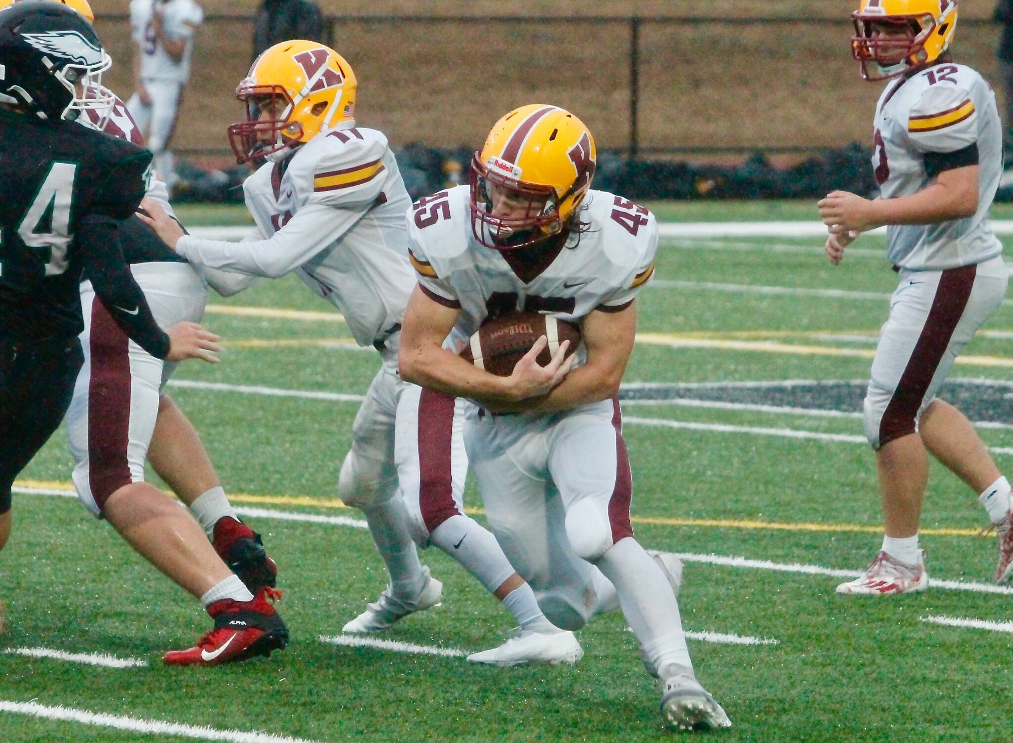 Kingston senior Sam Reber looks for running room against Klahowya. He finished the game with 76 yards and a touchdown for the Bucs. (Mark Krulish/North Kitsap Herald)