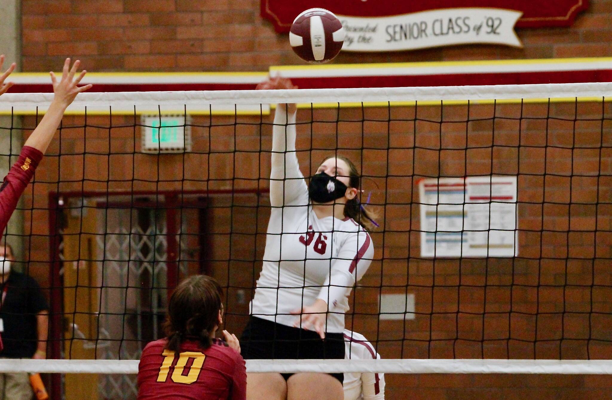 South Kitsap junior Anna Harvey drops a shot past the Kingston defense. The Wolves defeated the Bucs three sets to two Monday night. (Mark Krulish/North Kitsap Herald photos)