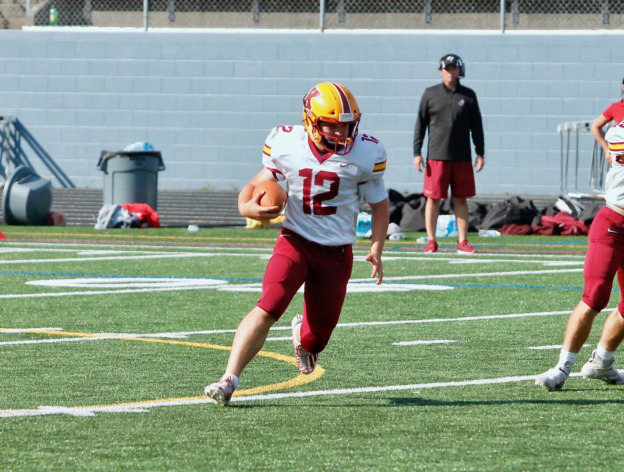 Kingston quarterback Brooks Arnim scored both touchdowns in the Bucs’ 27-13 loss to North Mason on Saturday. (Mark Krulish/Kitsap News Group)