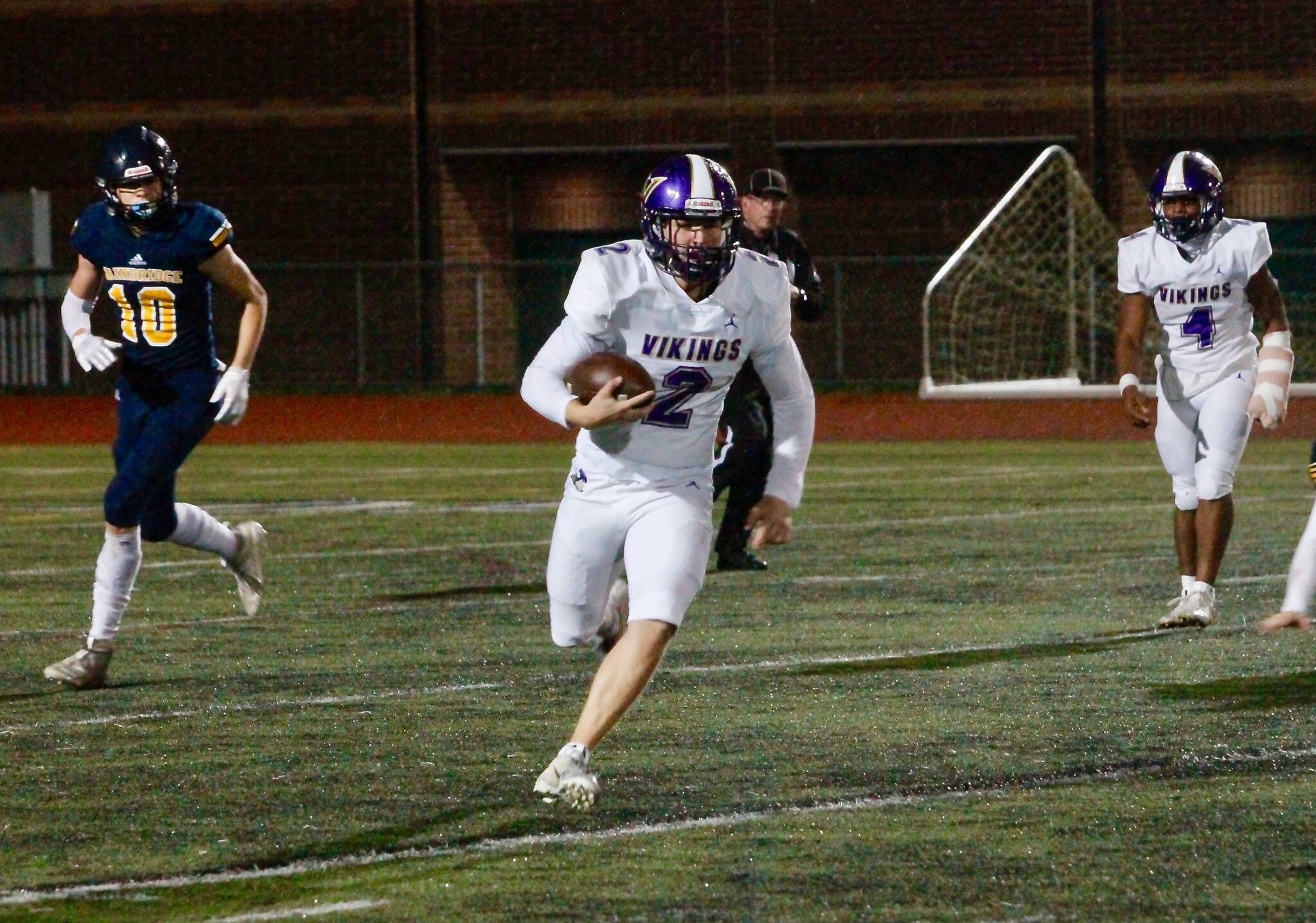 The North Kitsap passing game struggled Thursday, but quarterback Colton Bower rushed for 133 yards and two touchdowns in his team’s 32-0 win over Bainbridge. (Mark Krulish/Kitsap News Group)