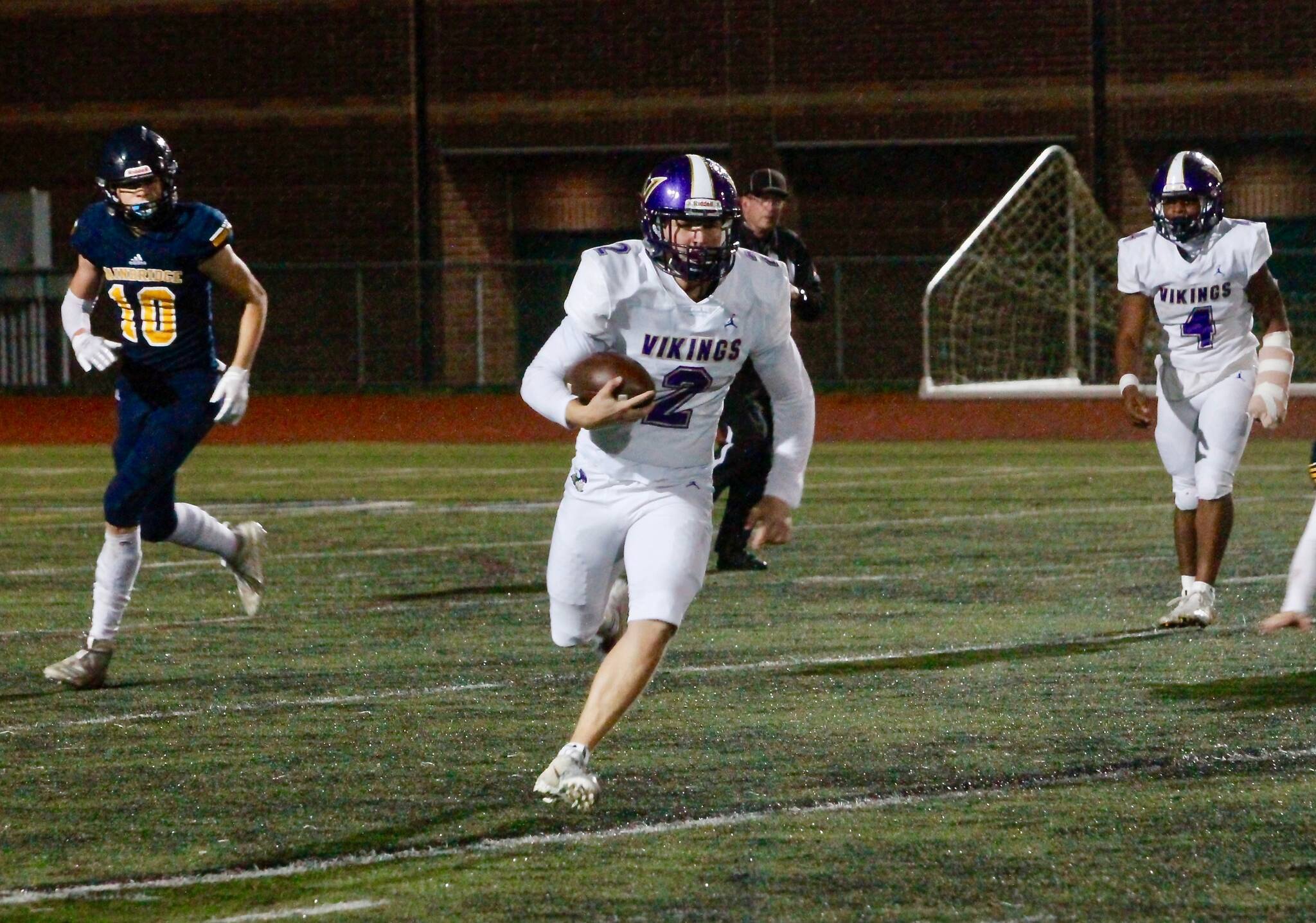 The North Kitsap passing game struggled Thursday, but quarterback Colton Bower rushed for 133 yards and two touchdowns in his team’s 32-0 win over Bainbridge. (Mark Krulish/Kitsap News Group)