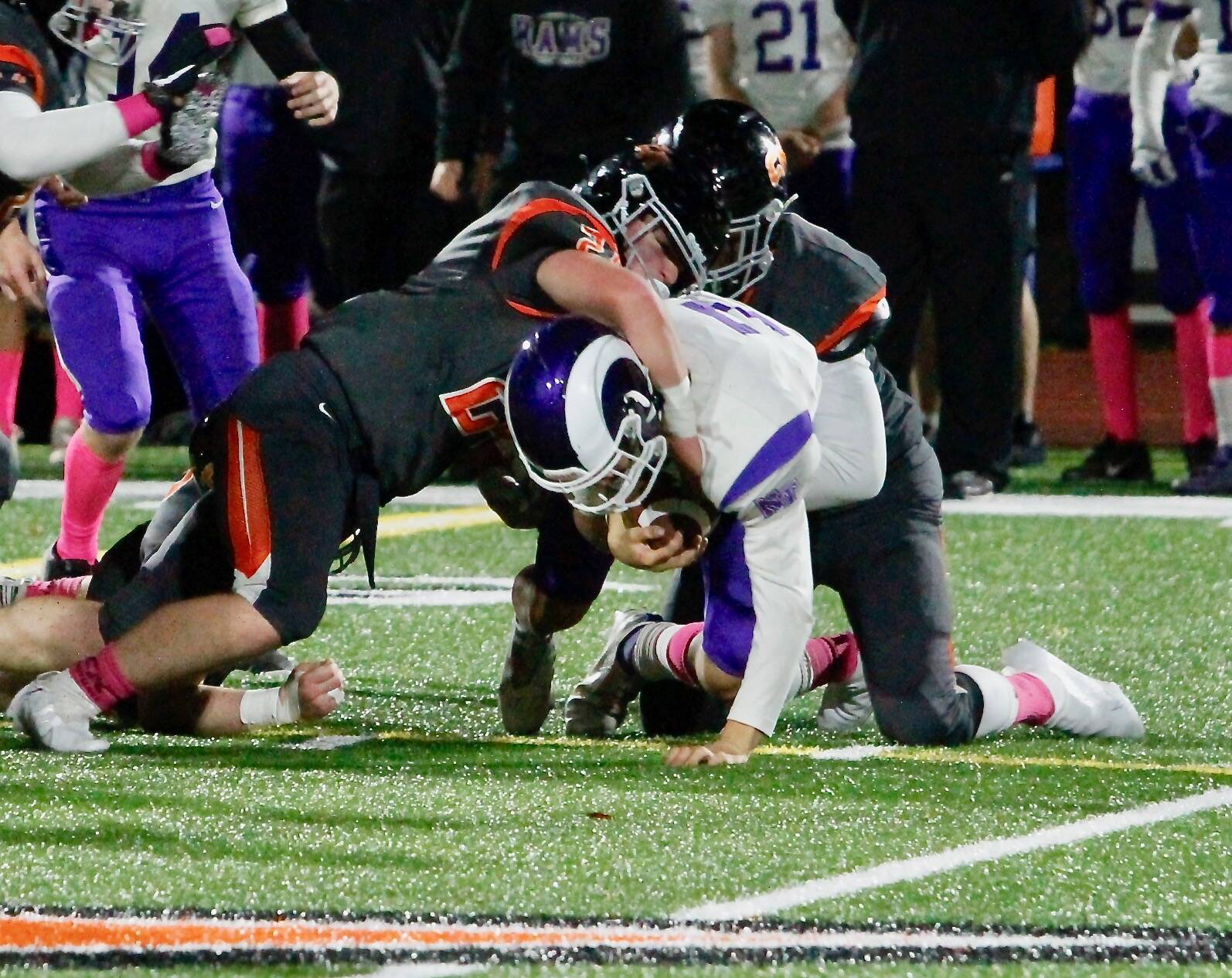 Easton Herdman (left) and Kelvin Gardner work together to bring down a North Thurston runners. Gardner had six solo tackles, plus four assists, including three for a loss. Herdman had four solo tackles, including two for a loss. (Mark Krulish | Kitsap News Group)