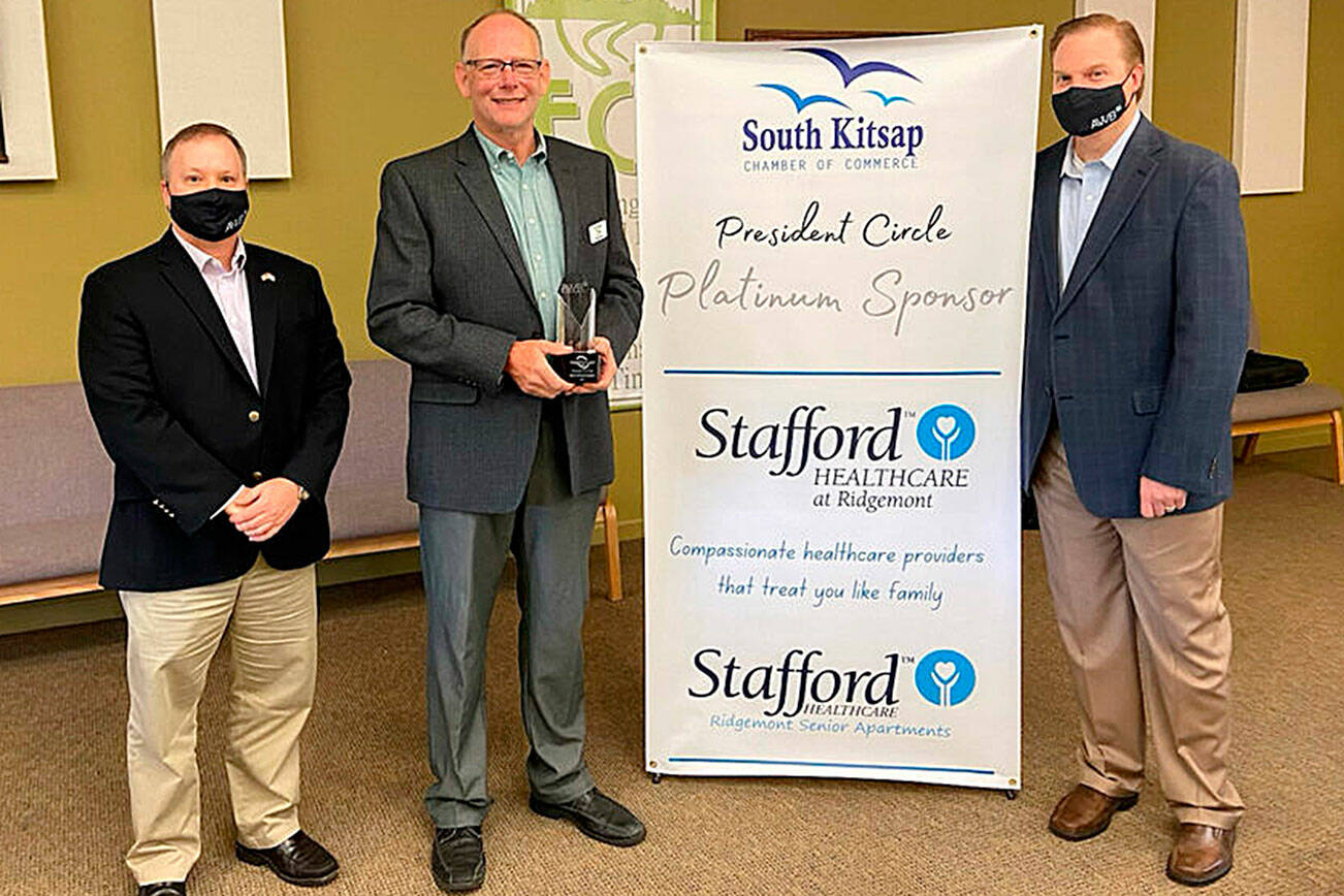 Matt Murphy, president/CEO of the South Kitsap Chamber of Commerce, received the 2021 AWB Grassroots Alliance Advocate of the Year Award from AWB President Kris Johnson, right, and AWB director of strategic engagement Dru Garson on Oct. 14, 2021.
