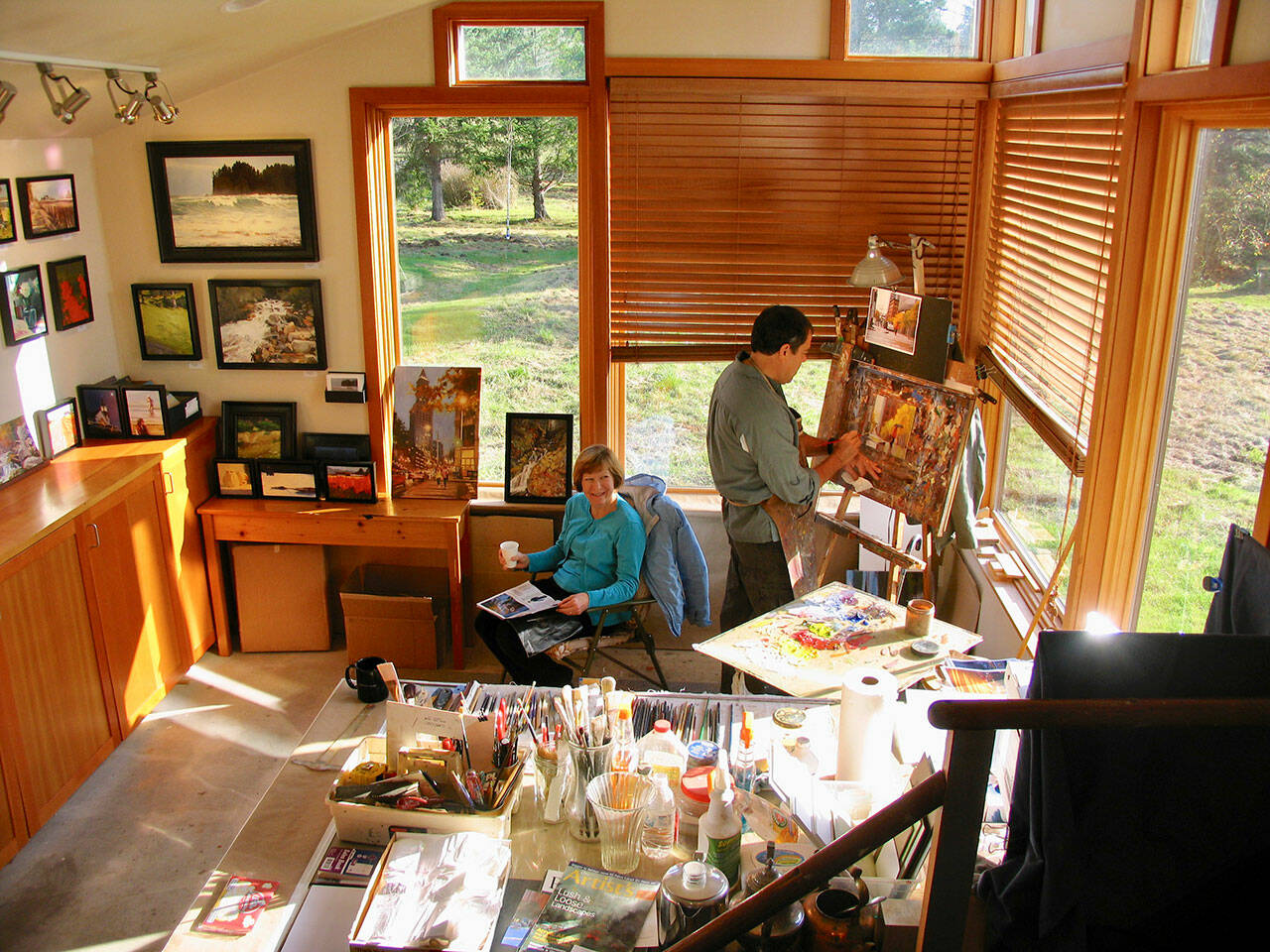 Local oil painter Robin Weiss (right) at work during a previous year’s Art in the Woods studio tour. Courtesy Photos