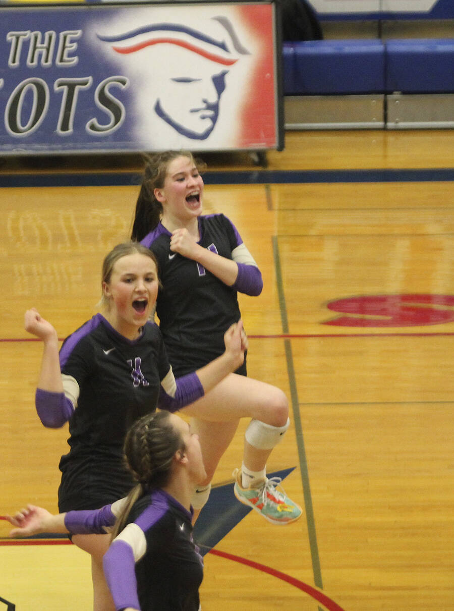 Maddie Pryde and Sophia Baugh celebrate winning a point.