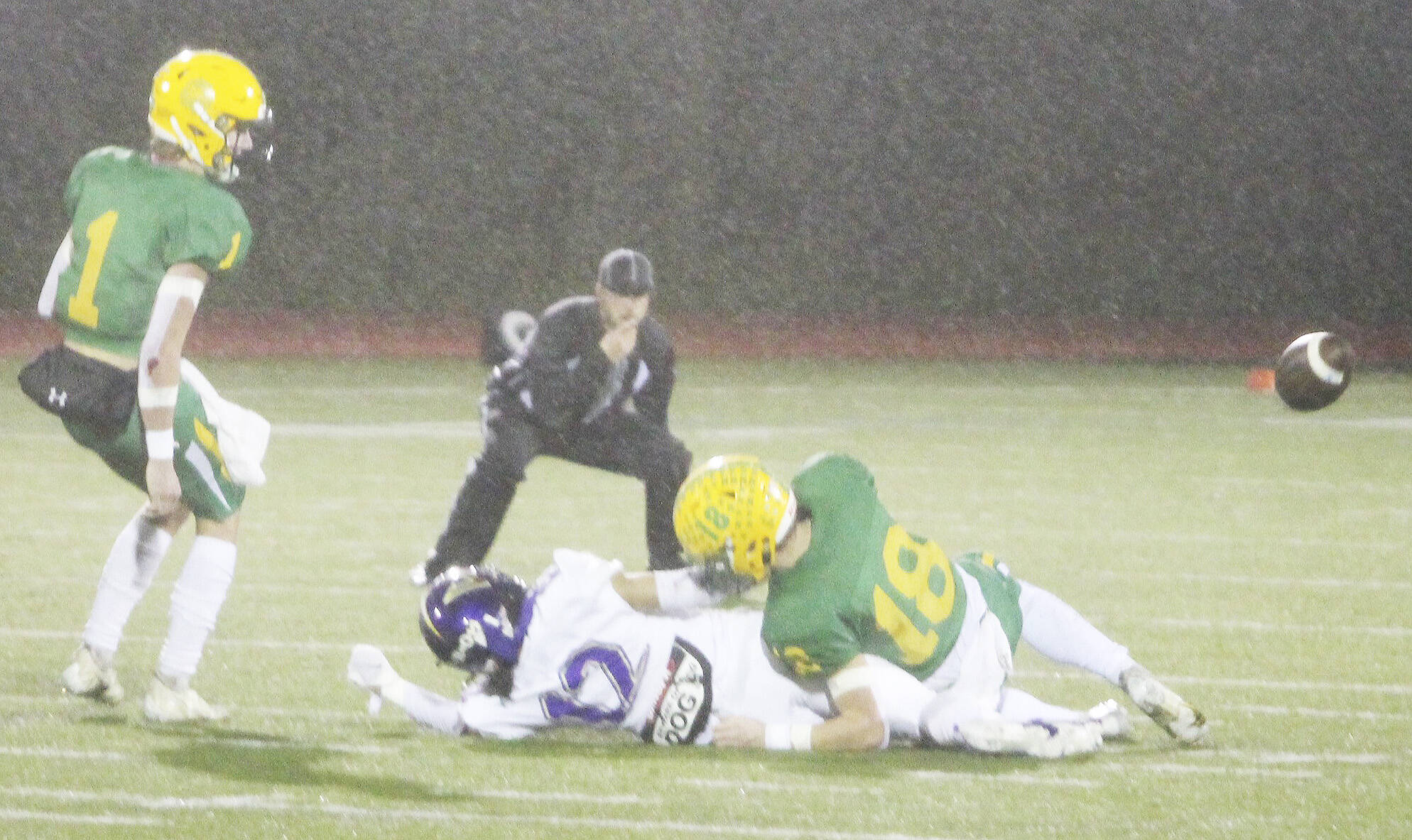 Viking Lincoln Castillo (12) is tackled to the ground as the incomplete pass flies by.