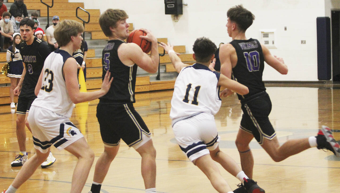 With Colton Bower (5) at the high post, Viking teammate Cade Orness (10) tries to rub off defender Breno Oguri (11) to get open as Johny Olmsted (0) looks on.