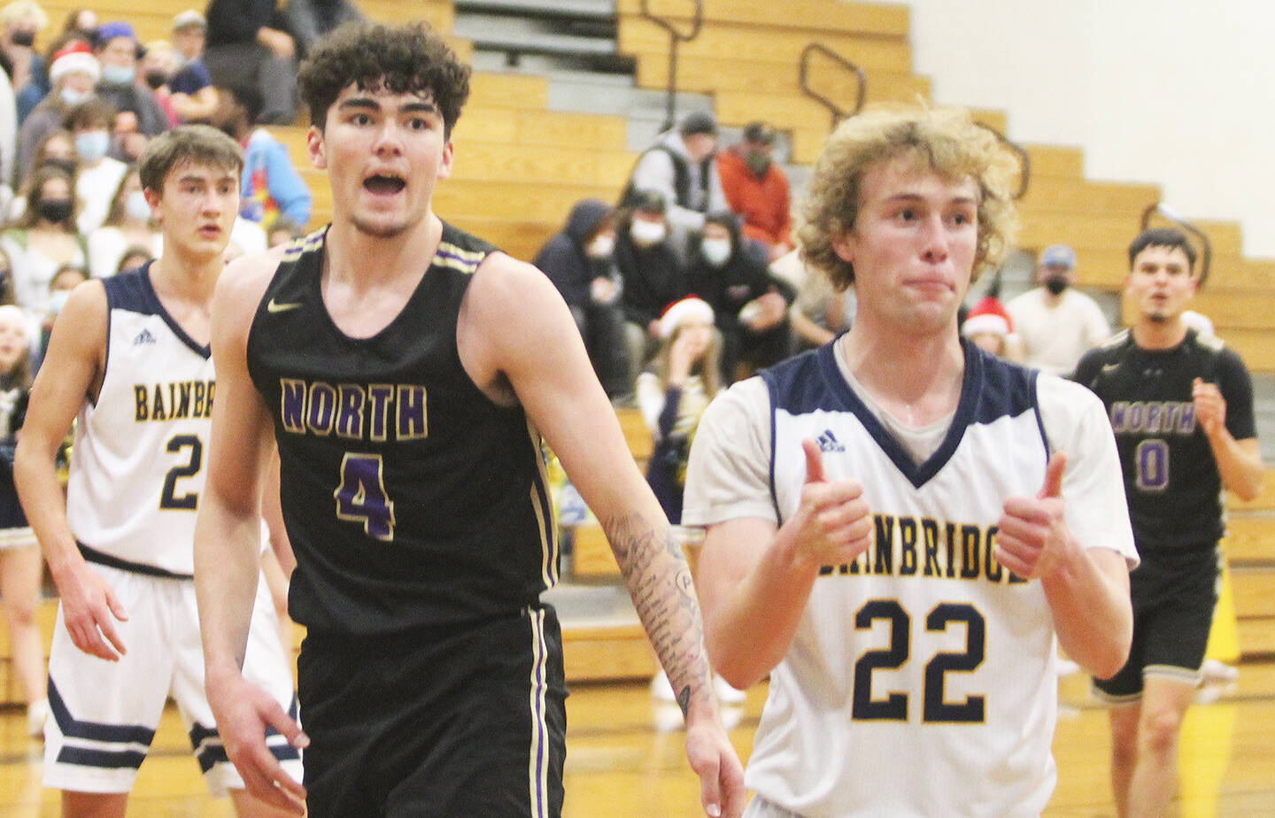Brayden Morgan (22) of Bainbridge seems to agree with the call, while Jonas La Tour (4) of NK doesn’t look too sure.