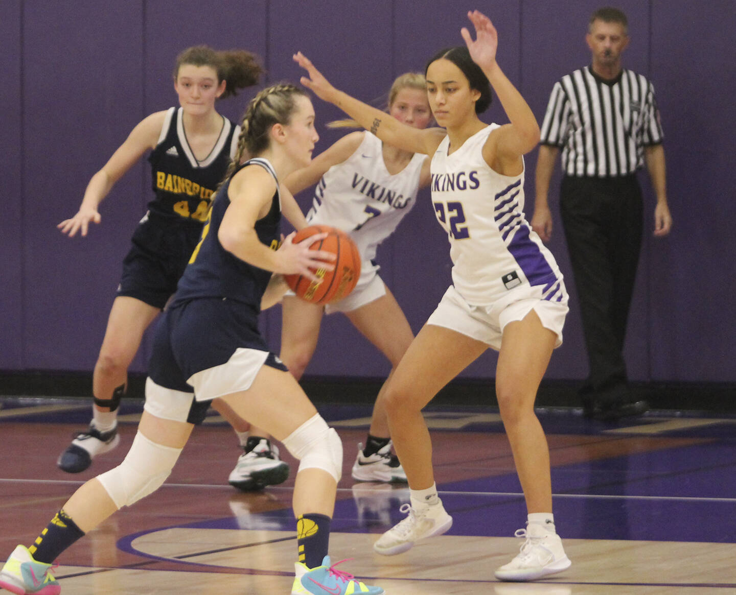 Grace Colburn (20) of Bainbridge drives to the hoop with Ayanna Selembo of NK defending.