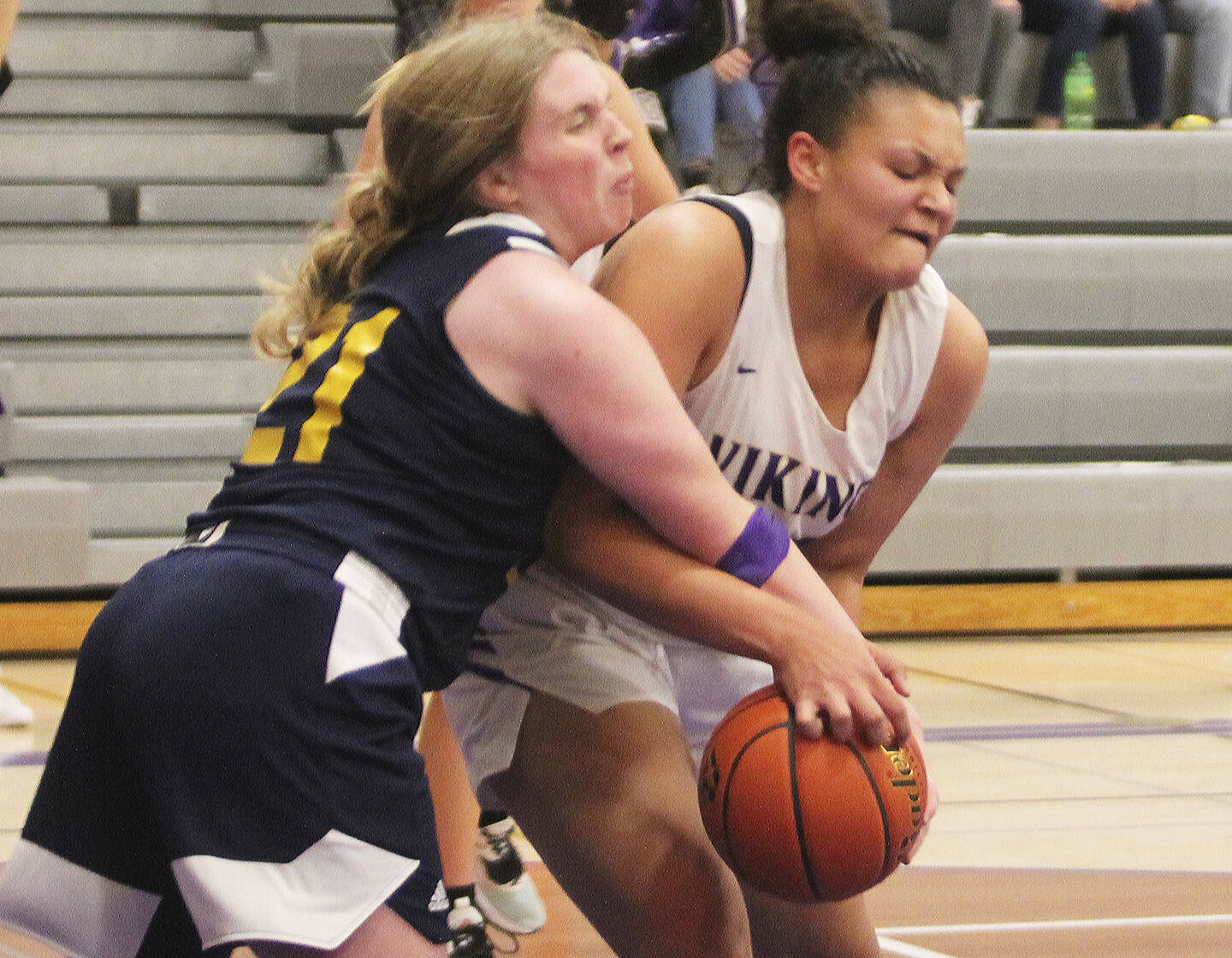 Maliyah Reed, right, fights with Ana Byers (21) of Bainbridge in the game.