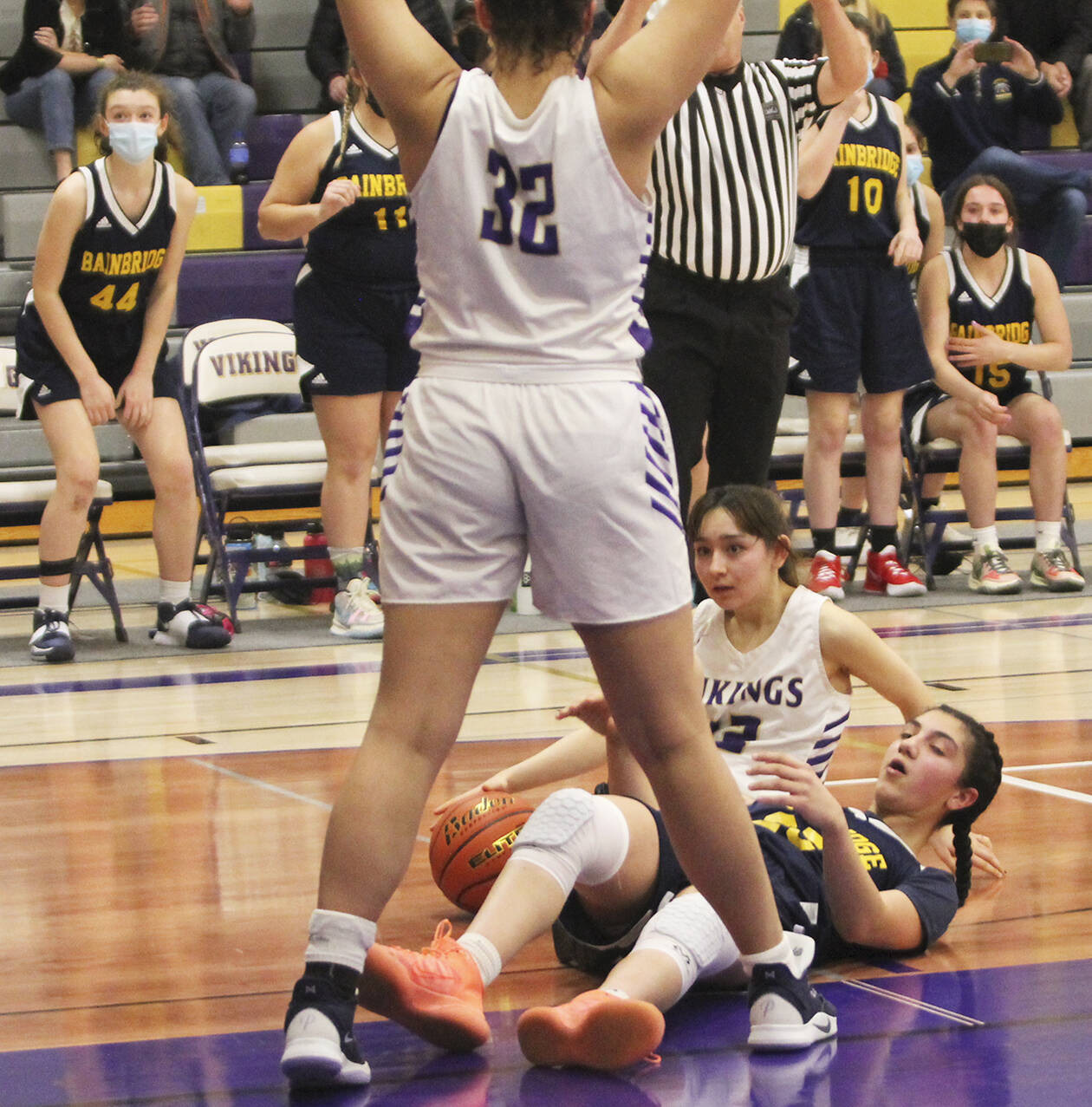 Jade Sunnenberg (12) of NK hits the floor with Ghadir Ramadan of BHS as they try to come up with a loose ball.