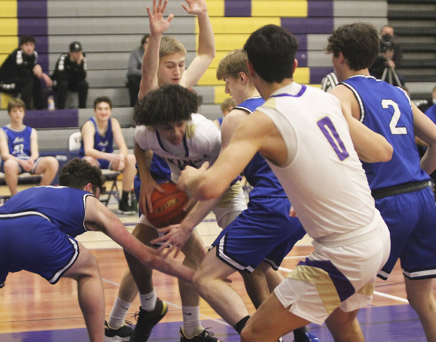 Viking Johny Olmstead (0) and many others from both teams converge under the basket.