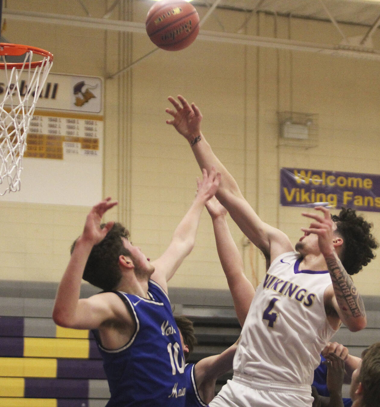 La Tour shoots a runner inside against tight defense.