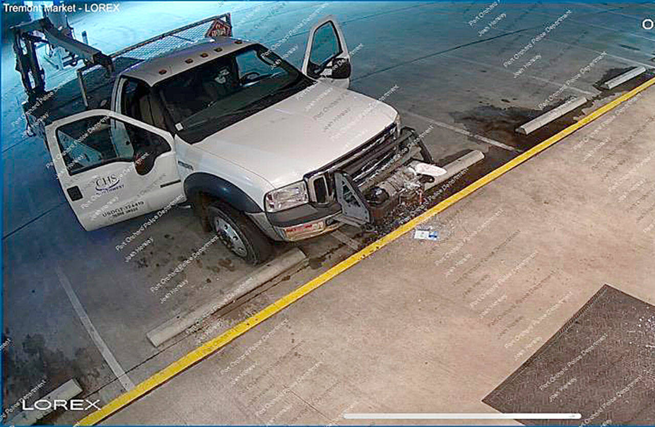A dual rear-wheeled Ford CHS Propane truck was seen on surveillance video driving into the front glass door of Extra Mile Convenience store early Wednesday morning. (Photo courtesy of Port Orchard Police Department)