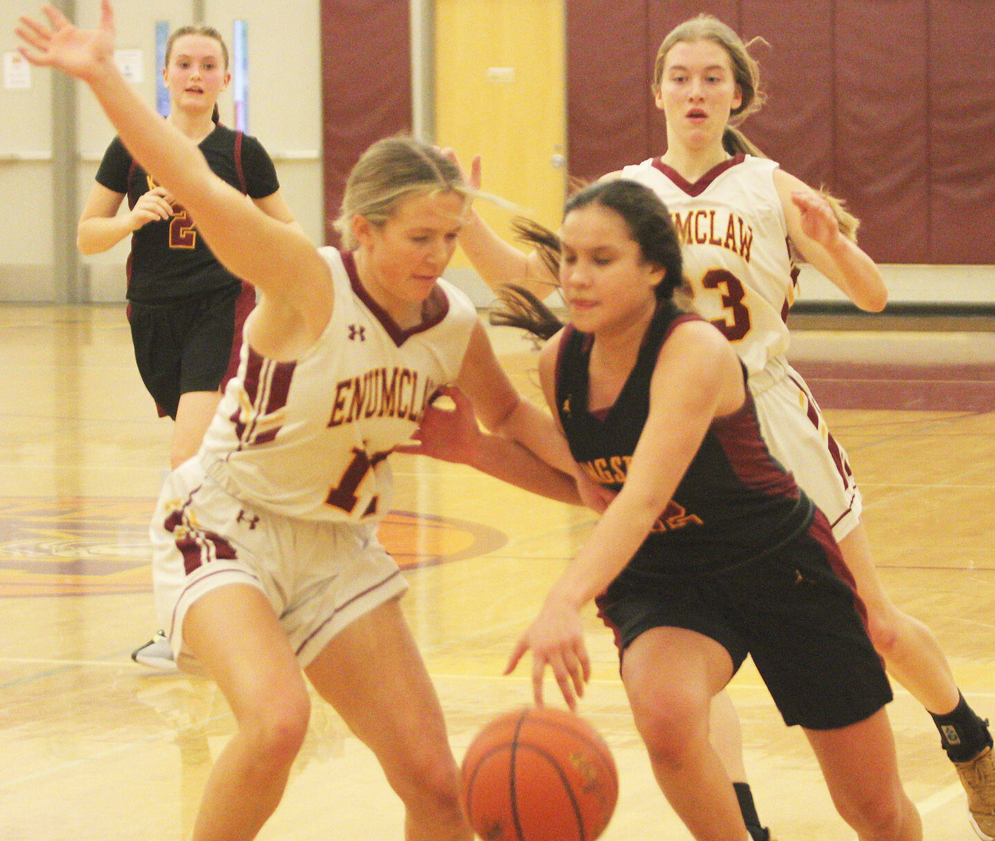 Brianna Jorgensen of Kingston drives to the basket in the contest against Enumclaw.