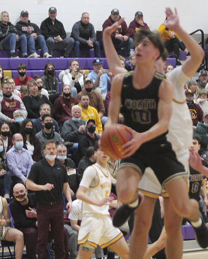 Viking Cade Orness tries a scoop shot inside. White River’s bigs caused NK to try some acrobatic shots in the game.
