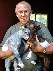 Ron Johnson and the family goats. (Photo by Paul Dostert)