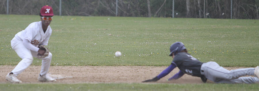 Kingston second baseman Terefa Rutherford waits for the throw from the catcher as Alex Elton of North Kitsap steals the base.