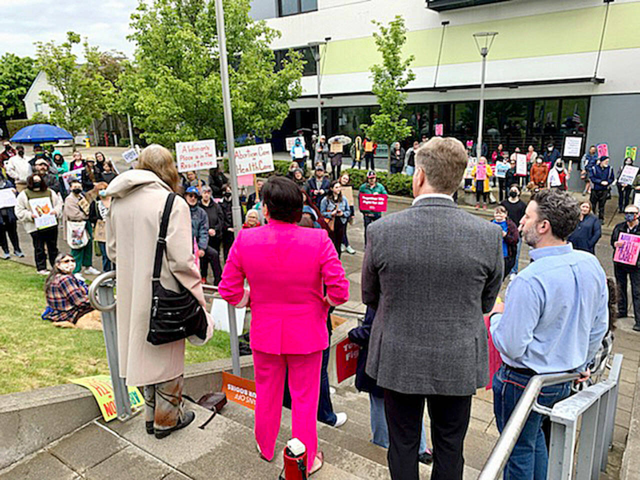 A crowd of about 100 people attends a reproductive rights rally on Friday in front of the Norm Dicks Government Building in Bremerton. (Bob Smith | Kitsap News Group)