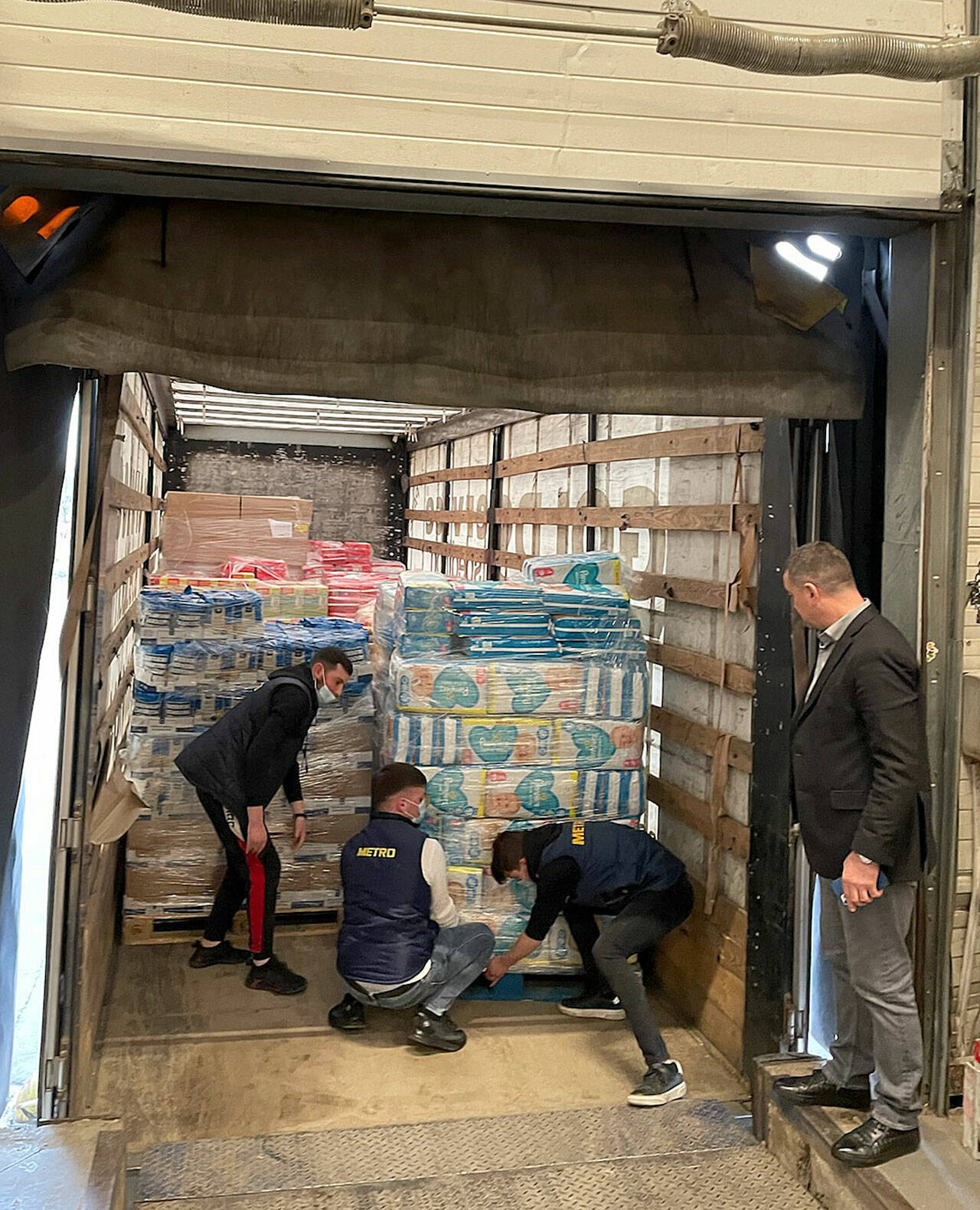 More than 100 tons of supplies for refugees are loaded on a semi-trailer in Moldova. (Courtesy photo)