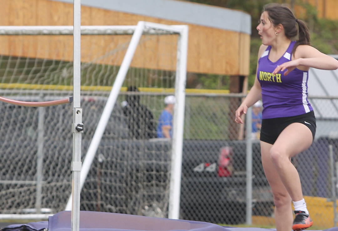 Steph Lara of NK is excited about the bar staying up during her high jump at a recent track meet.