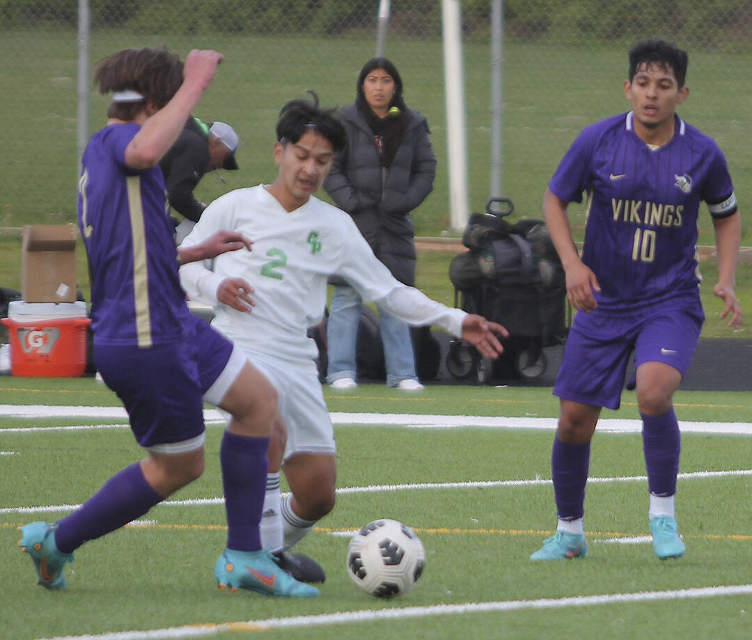 Jonathan Mendoza (10) of NK moves in to try to take the ball away from Clover Park.